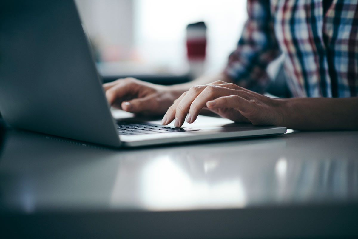 iStock-617759118 Man on computer